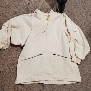 Free people movement light yellow sweater. Size M